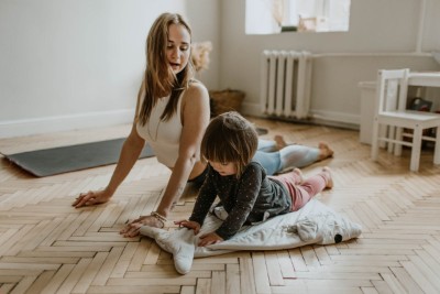 Mom and child doing yoga, staying engaged while working from home